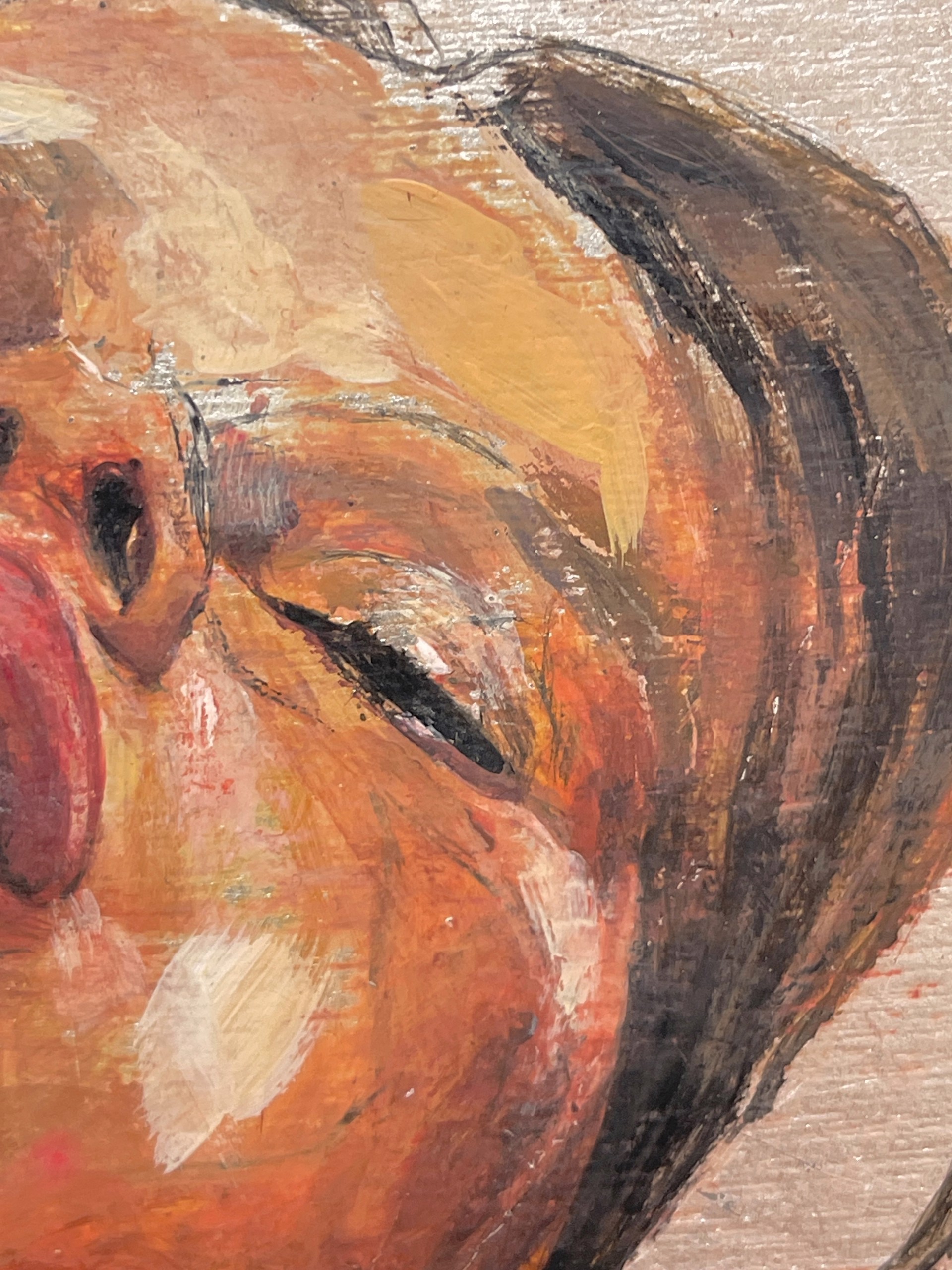 A painting of a woman's face on a wooden surface.