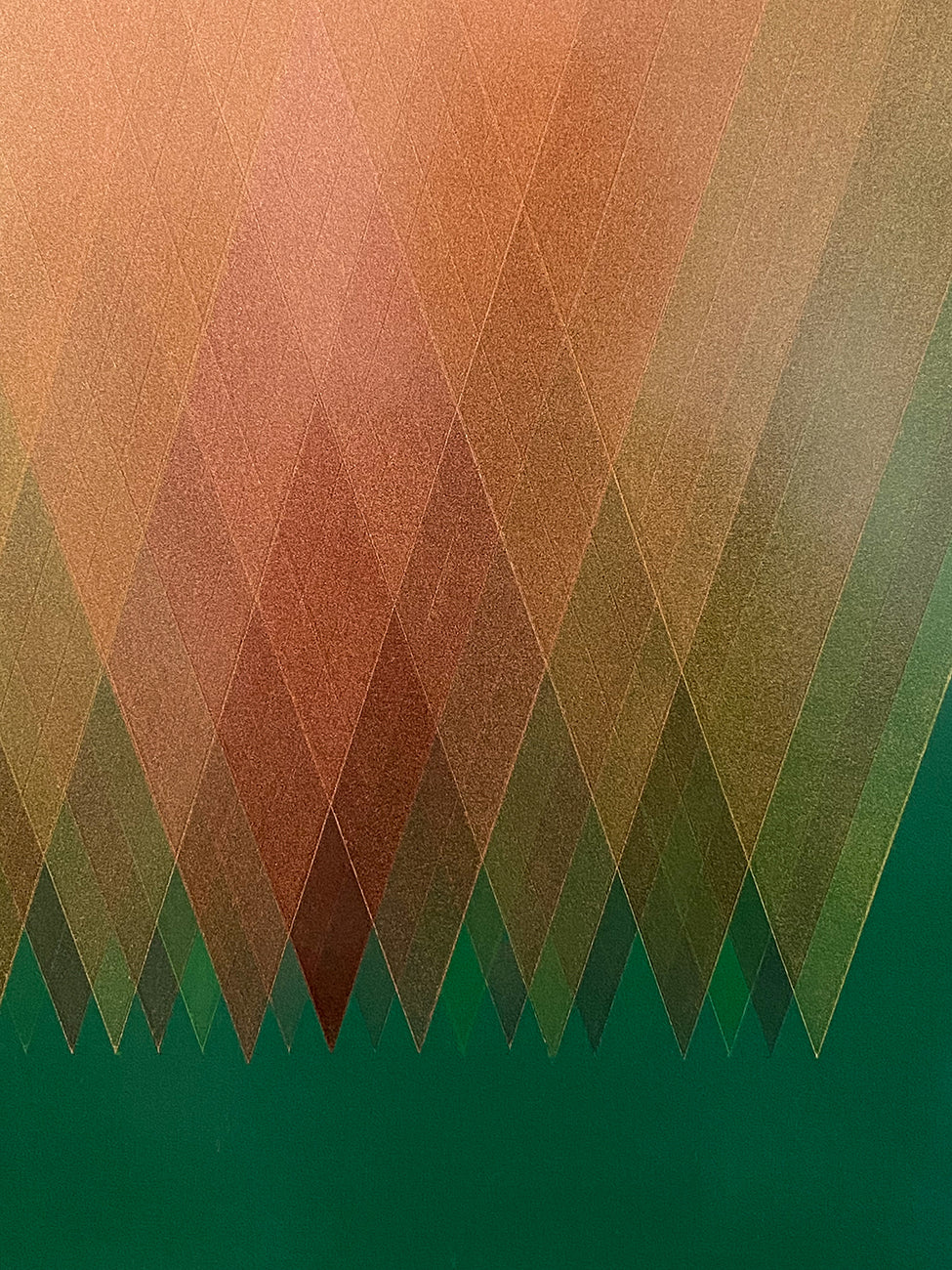 A picture of an abstract geometric design on a green background.