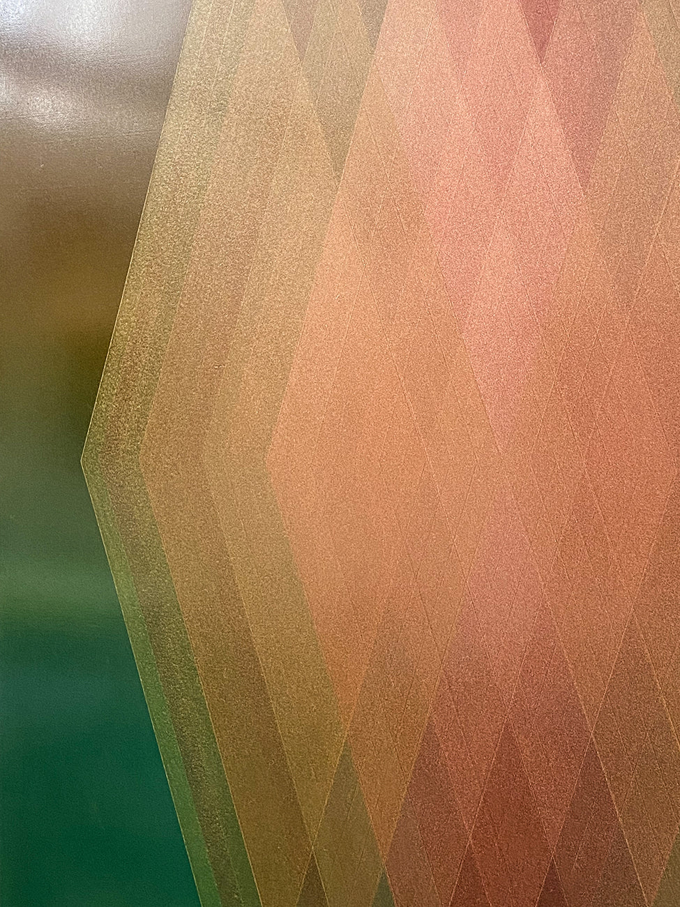 A picture of an abstract geometric design on a green background.