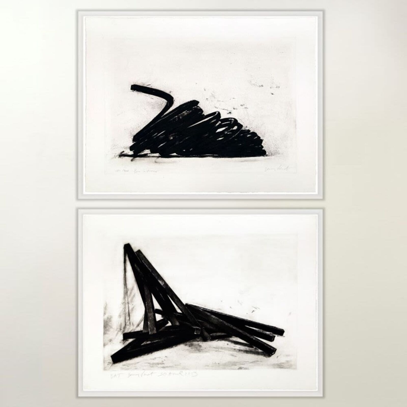 A diptych of charcoal drawings featuring abstract black forms against stark white backgrounds.