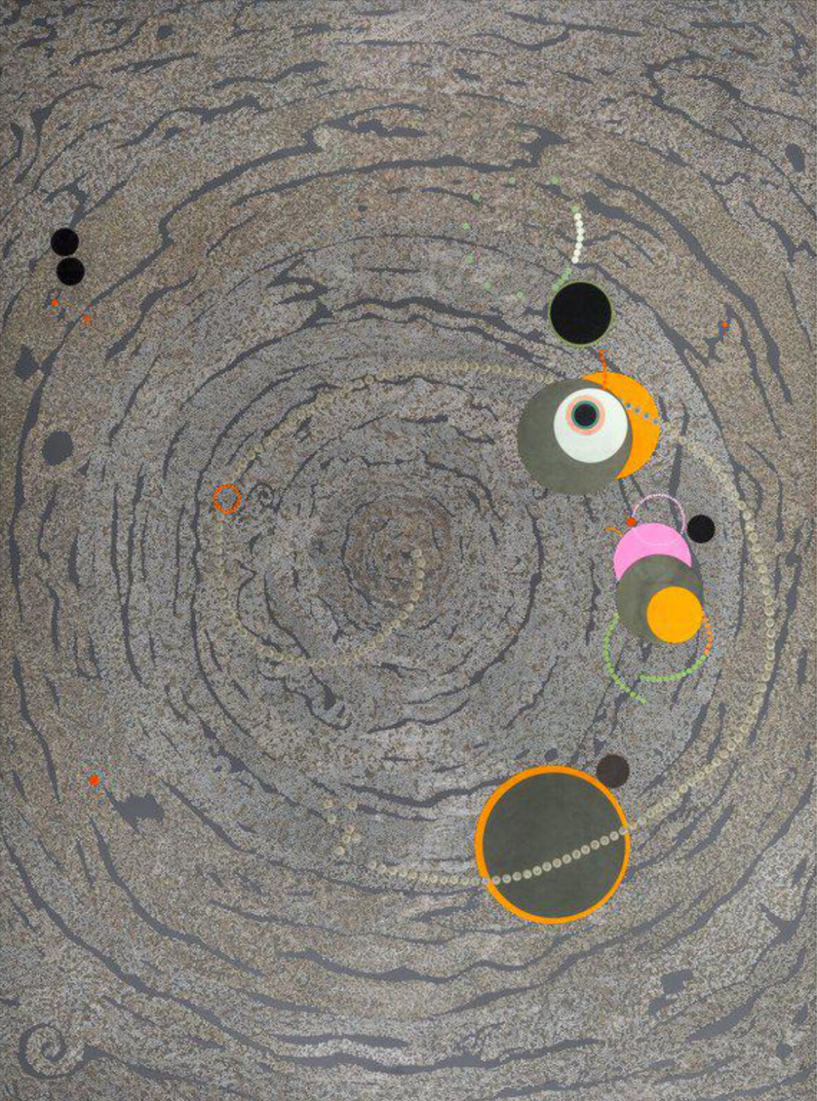 A painting of circles and dots on a gray surface.