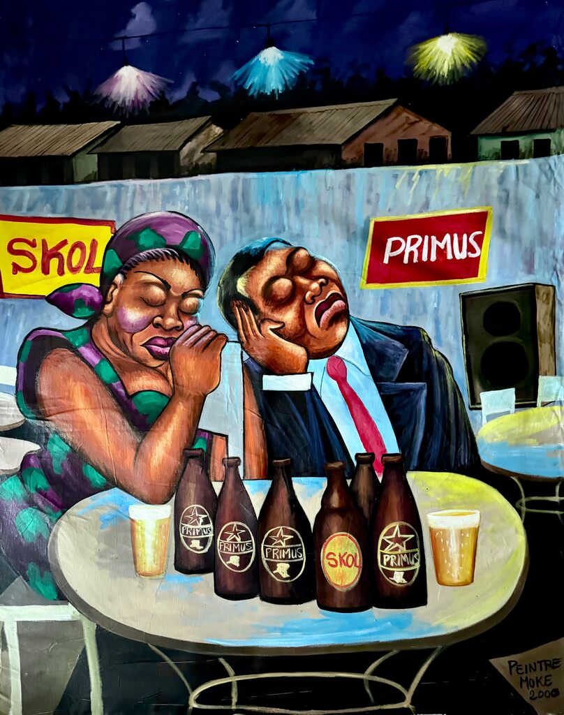 A vibrant painting of two figures slumped over a table filled with beer bottles and glasses.