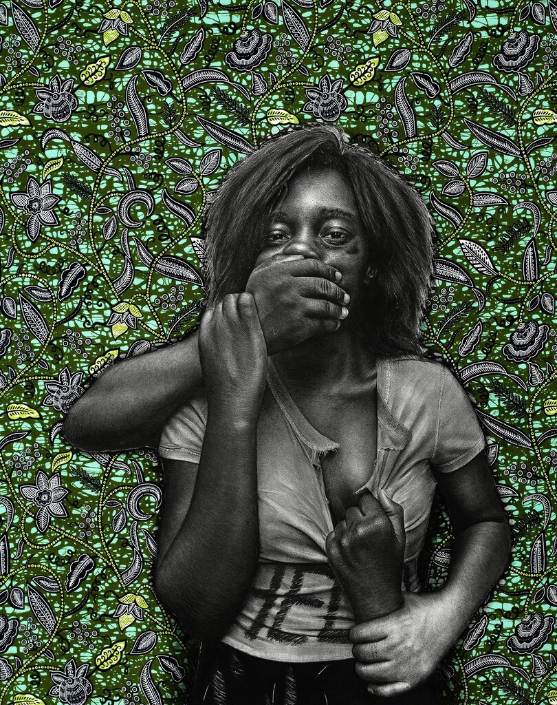 A black-and-white portrait of a person clutching their chest against a vibrant, patterned green background.