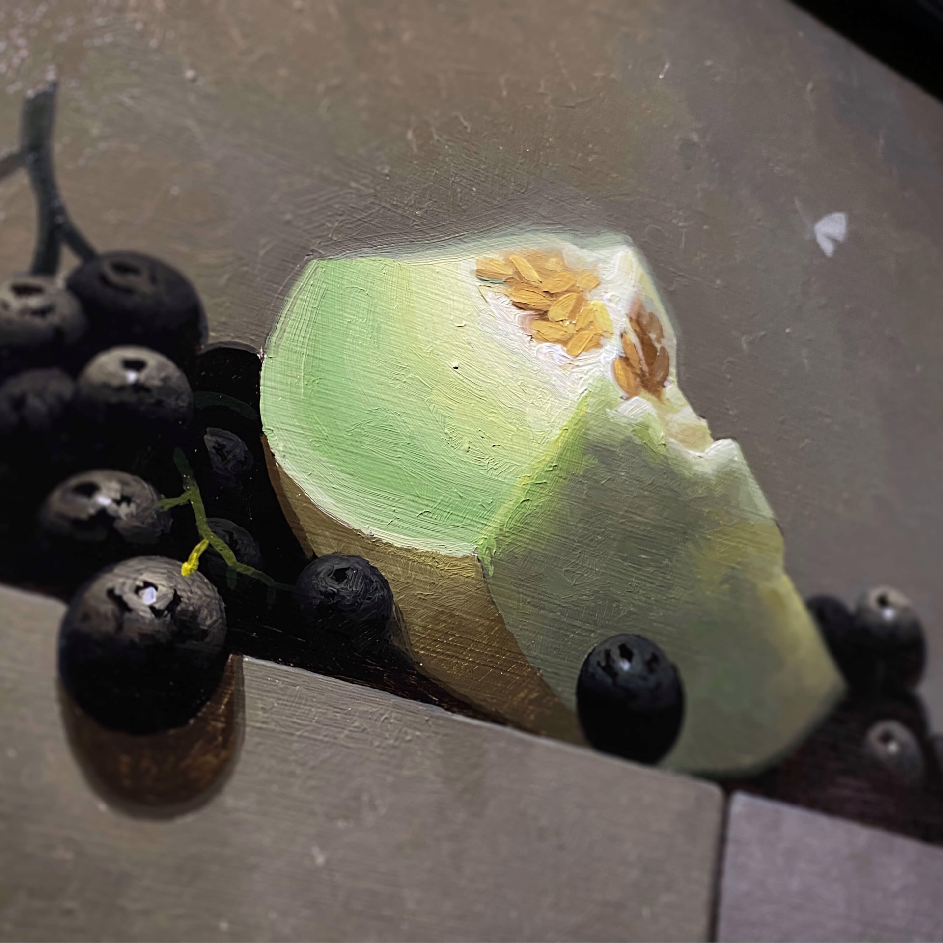 A painting of a piece of cheese and some blackberries.