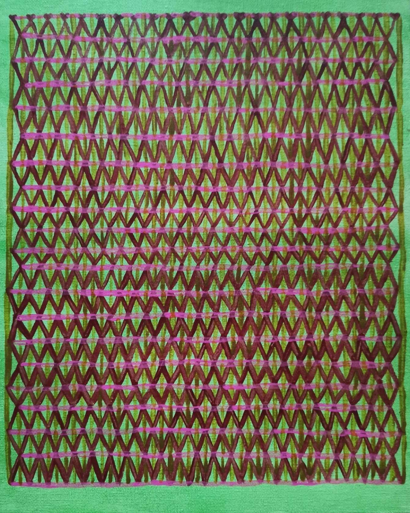 A green and pink rug with a pattern on it.