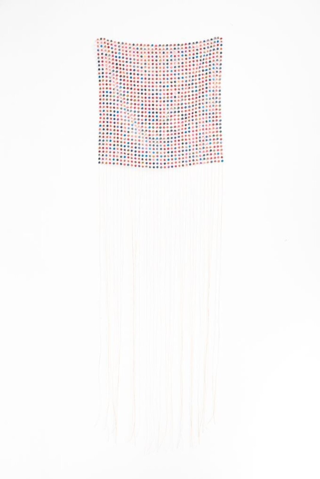 A colorful grid of small, patterned spheres arranged in a wavy formation against a stark white background.