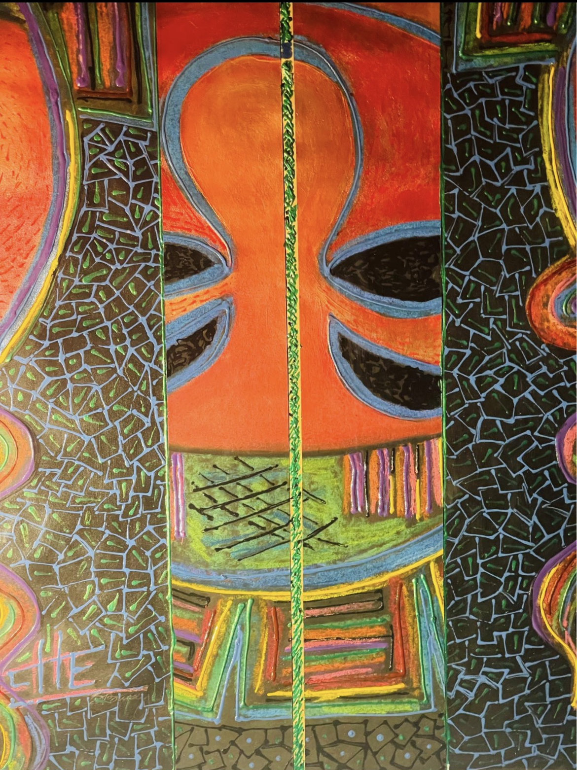 A vibrant, symmetrical abstract portrait featuring a stylized face with mosaic textures and bold colors.