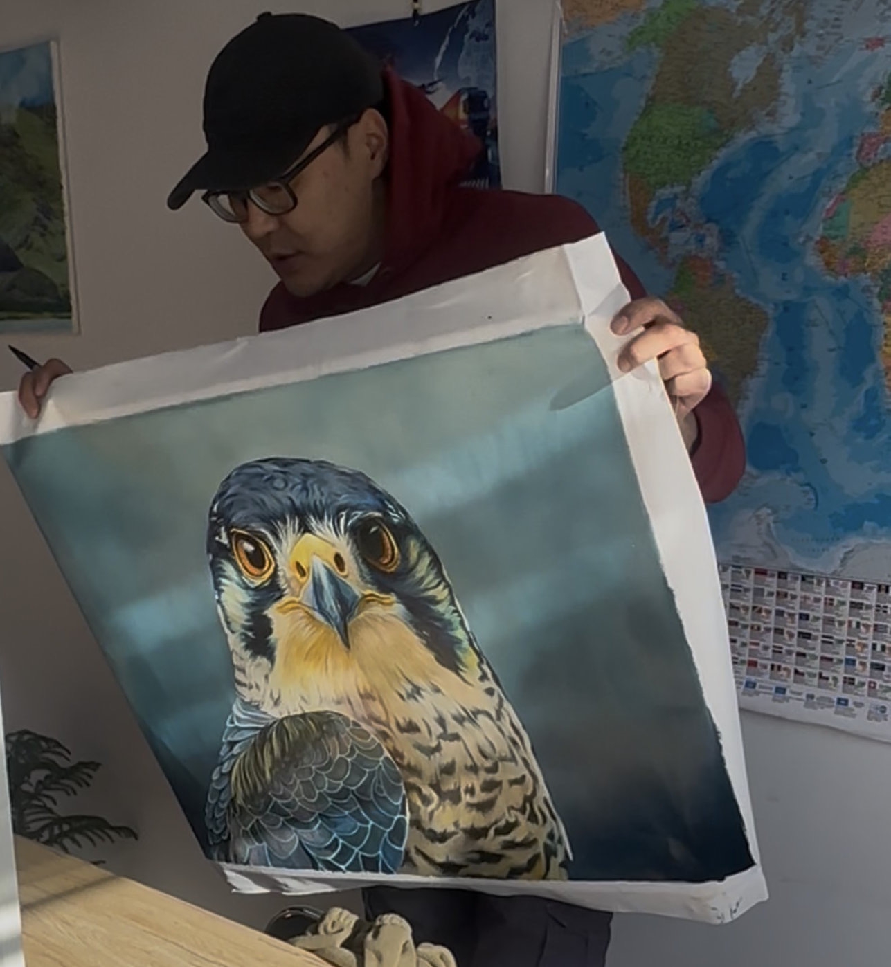 A realistic portrait of a bird with intense eyes and detailed feathers against a dark background.