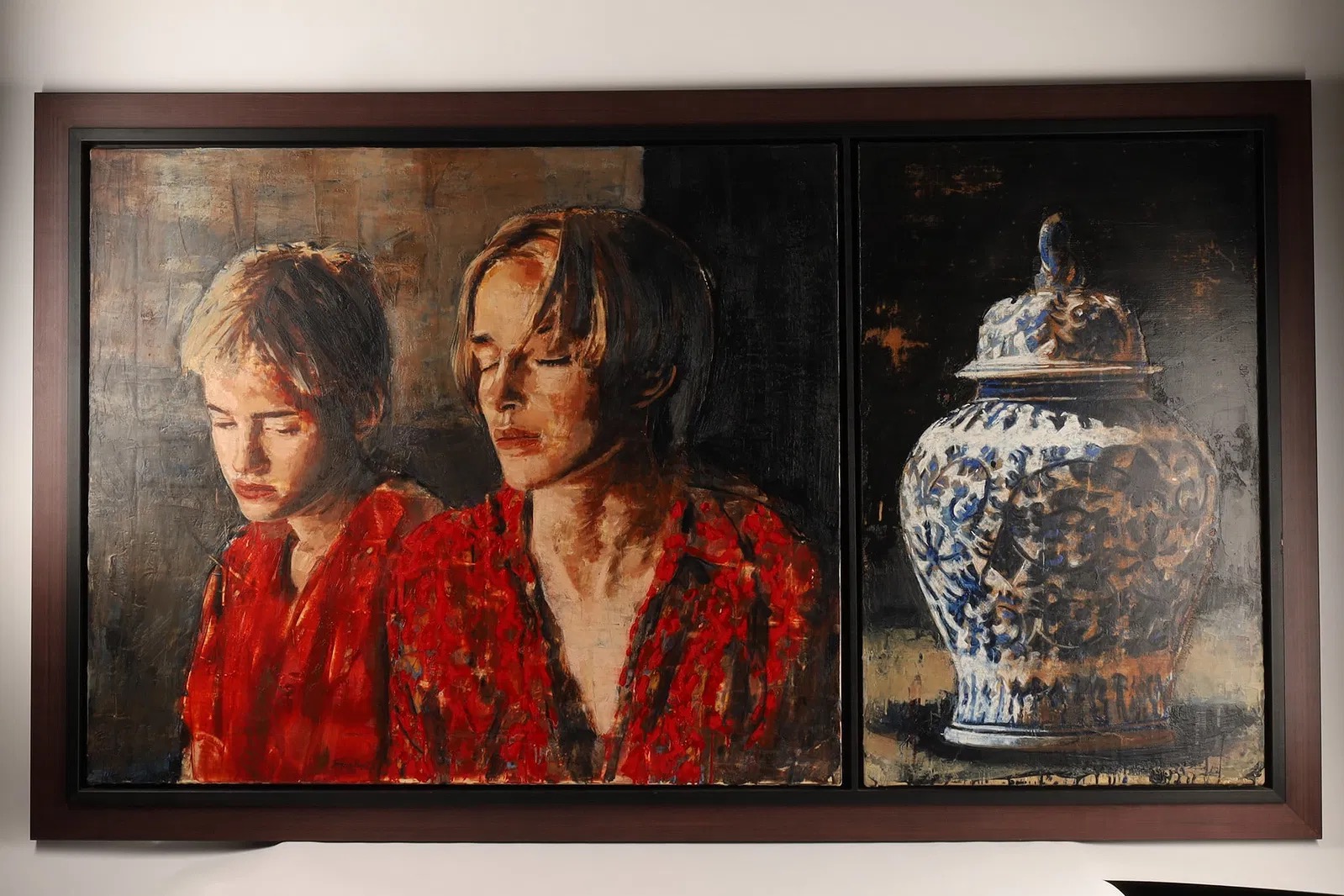 A couple observes a triptych painting in a gallery, featuring two figures in red and a blue-and-white vessel.