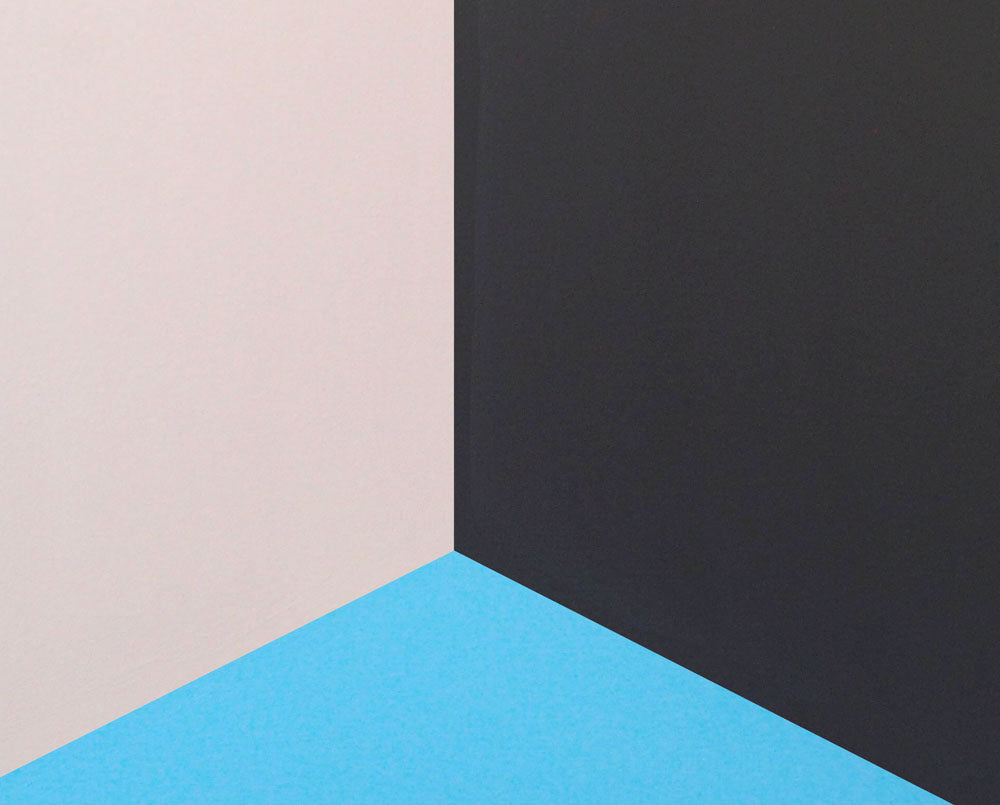 A black, yellow, and blue painting on a white wall.