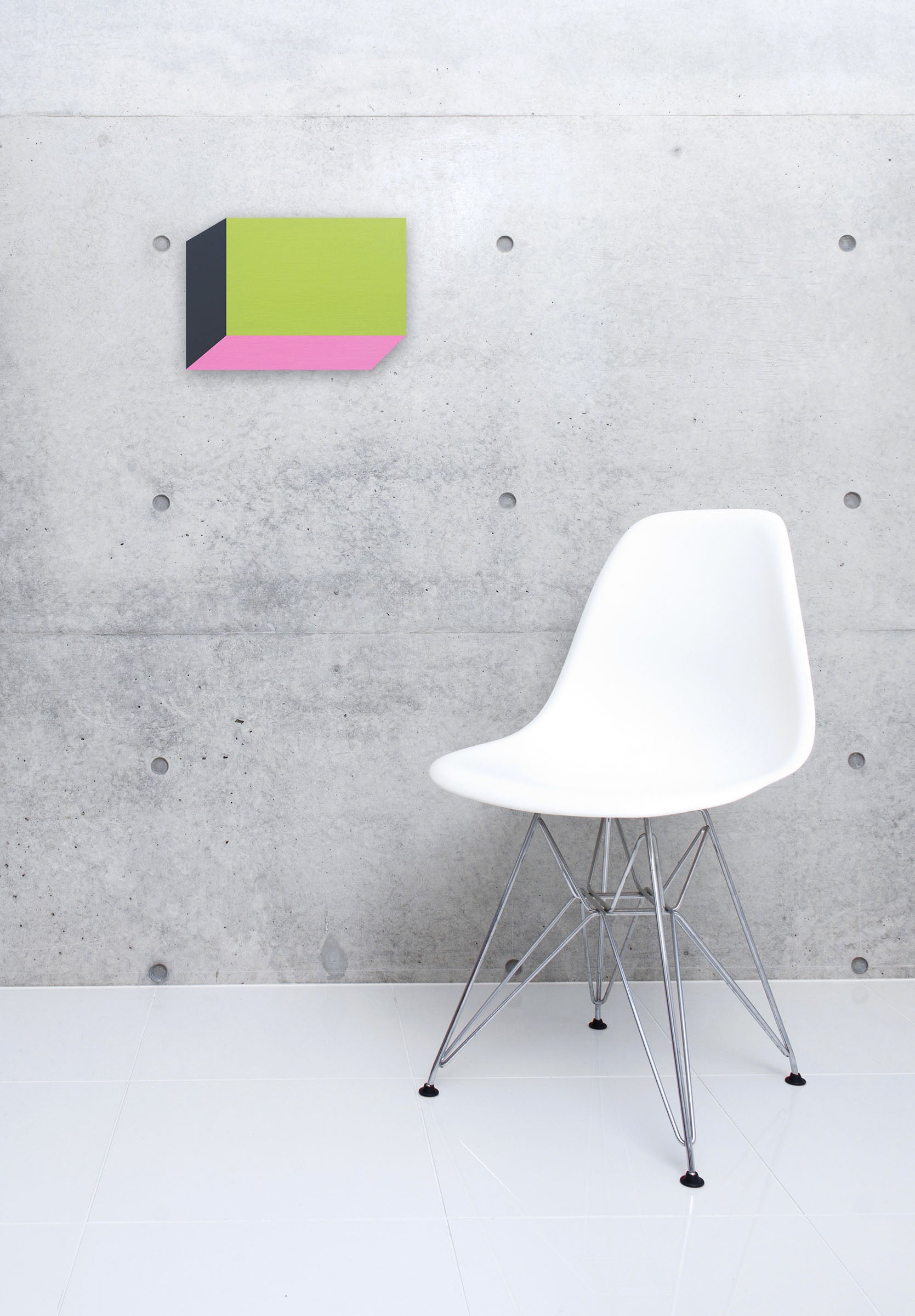 A piece of paper with a pink and green color block on it.