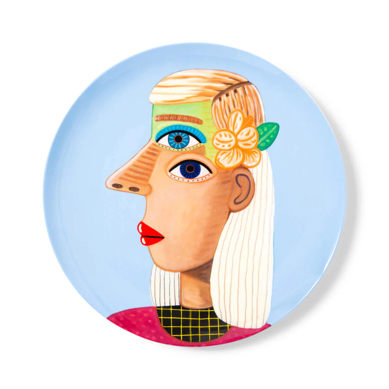 A plate with a painting of a woman's face on it.