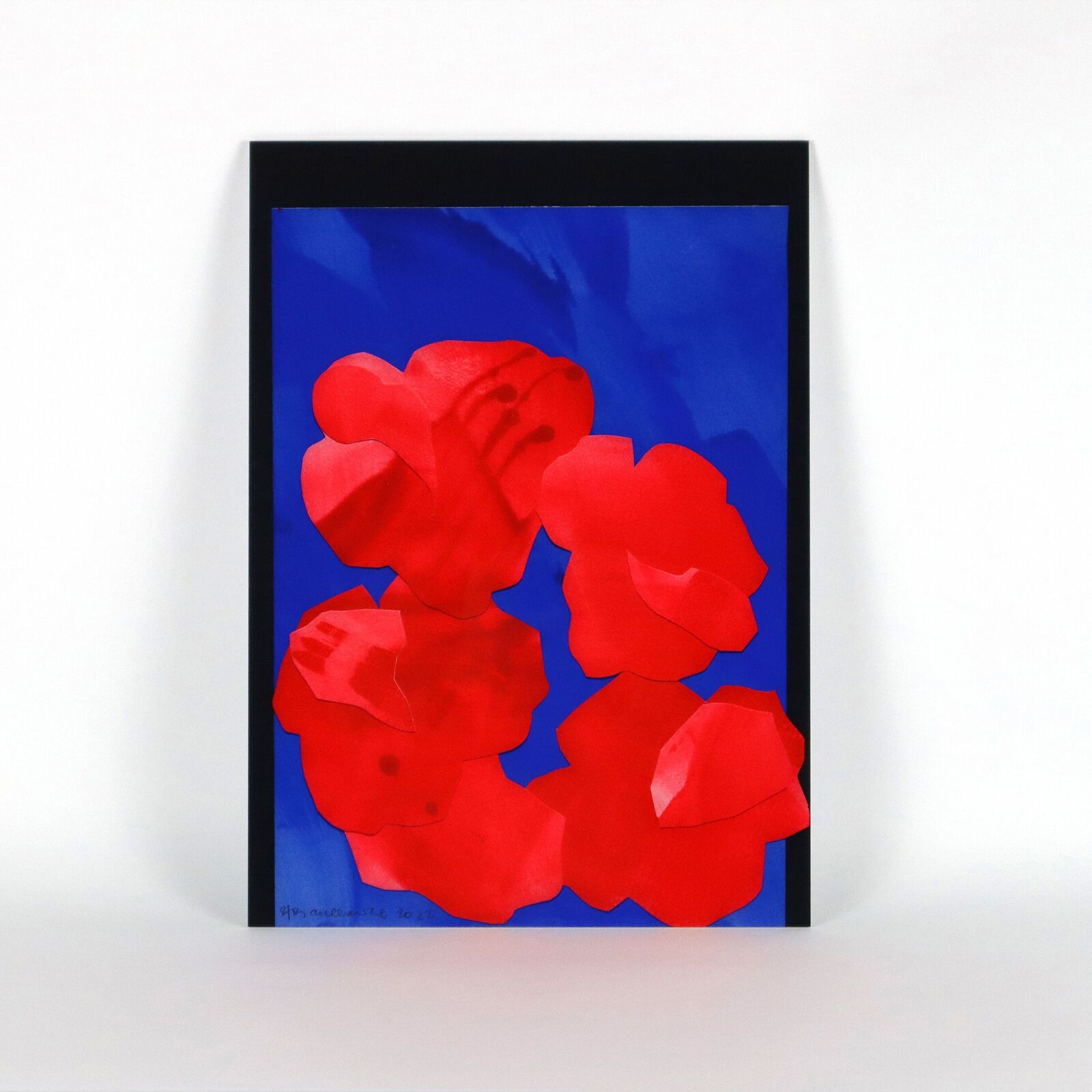 A set of six paintings of flowers on a white wall.