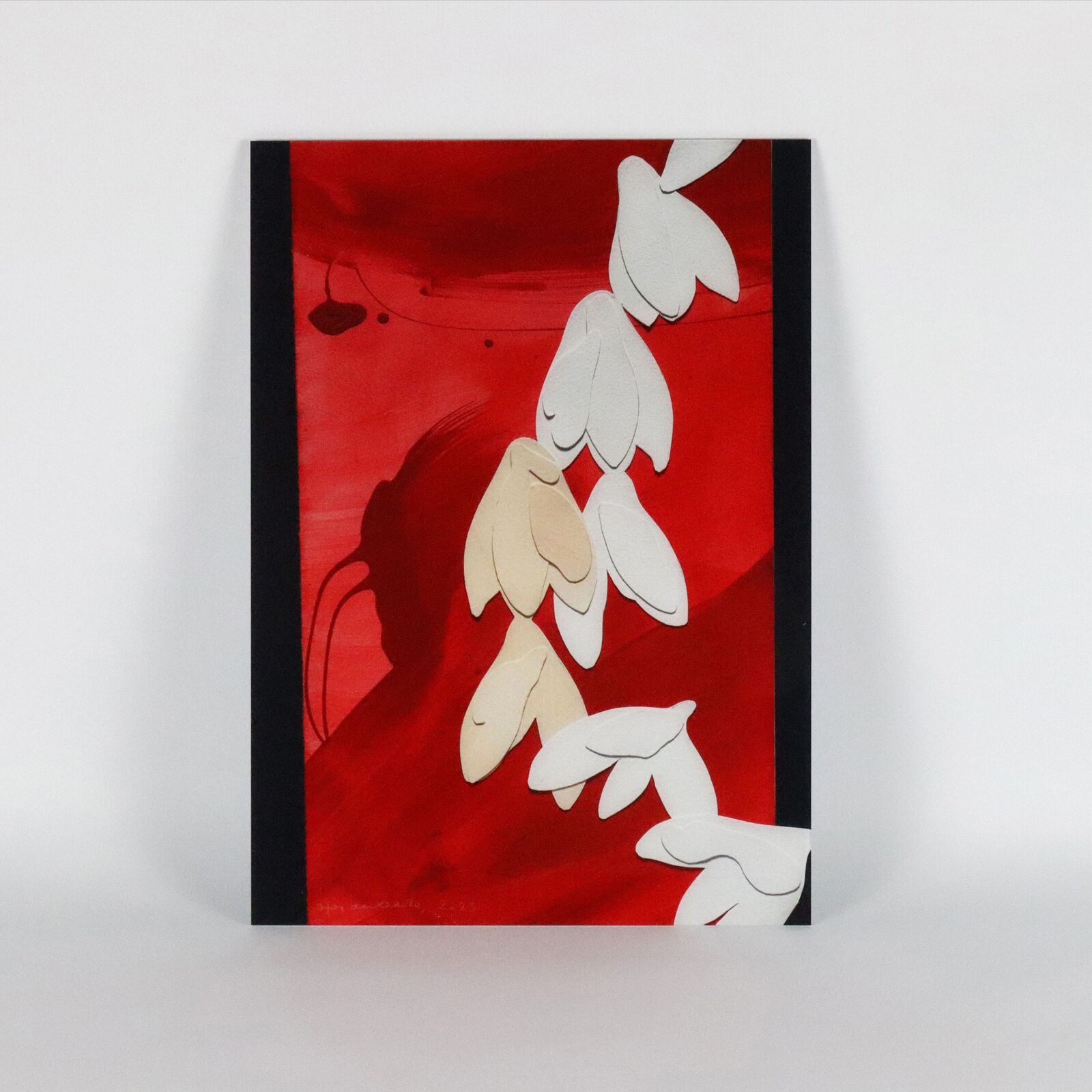 A set of six paintings of flowers on a white wall.