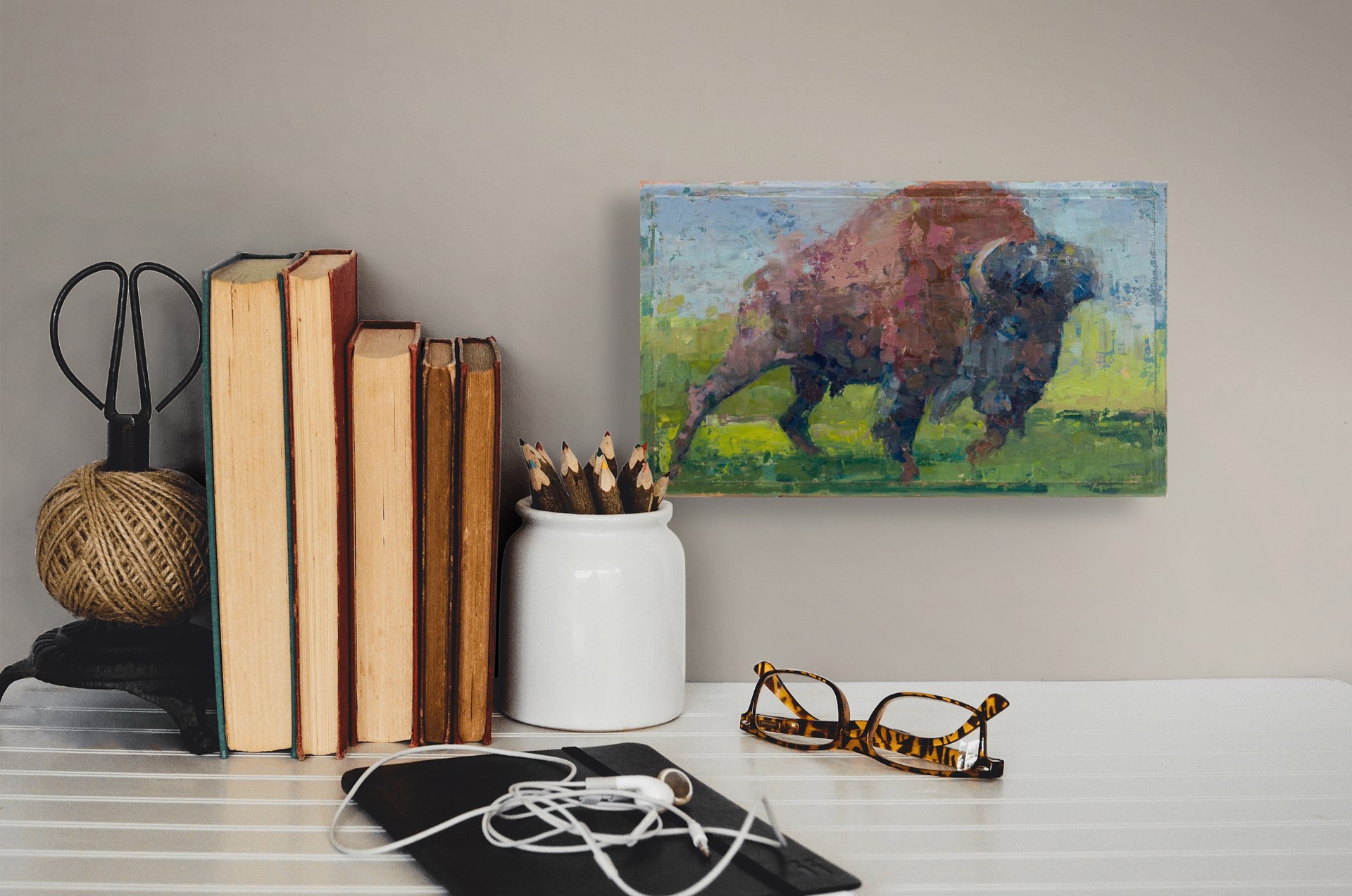 A bold, textured painting of a large bovine figure charging forward.
