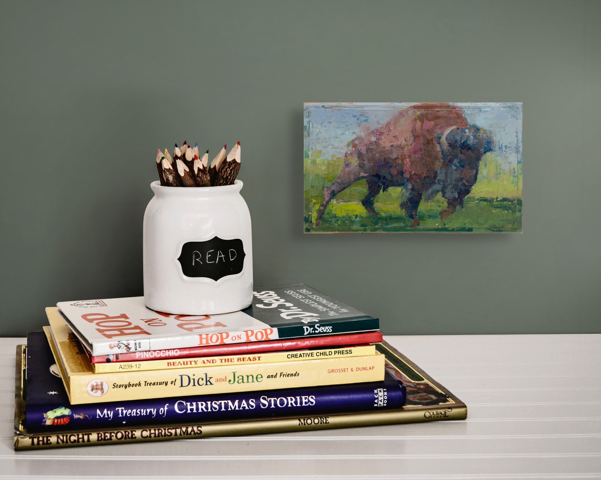 A bold, textured painting of a large bovine figure charging forward.