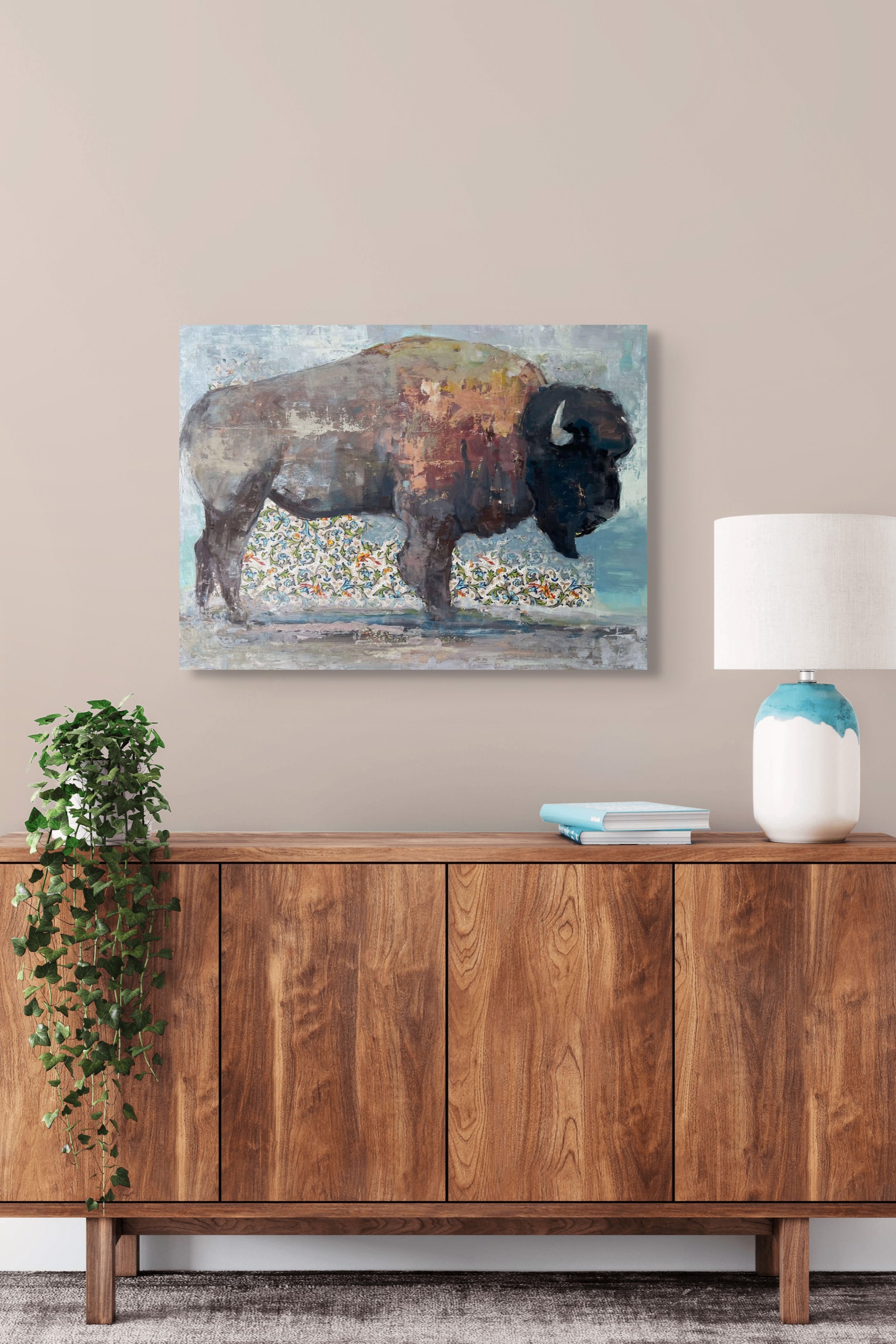 A painting of a bison standing in front of a wall.