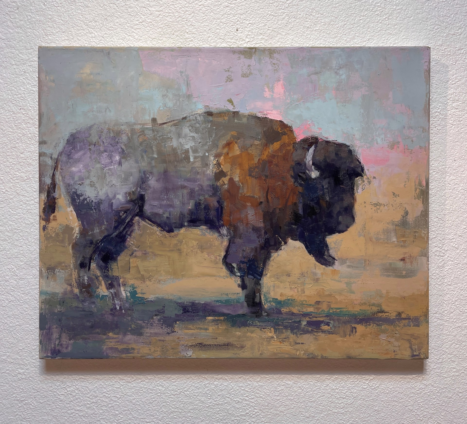 A painting of a bison standing in a field.
