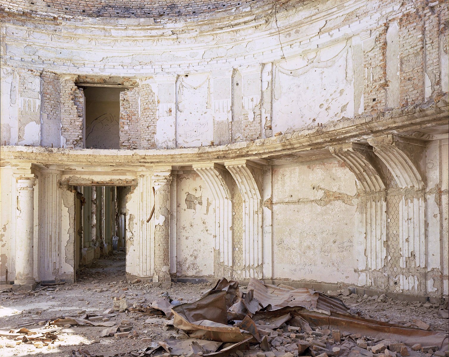 A large building with a lot of rubble on the ground.