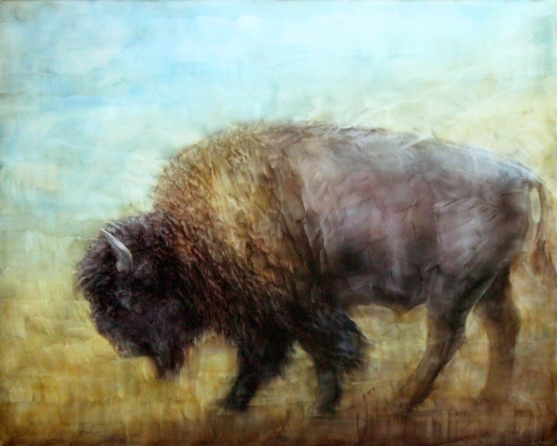 A painting of a bison walking across a field.