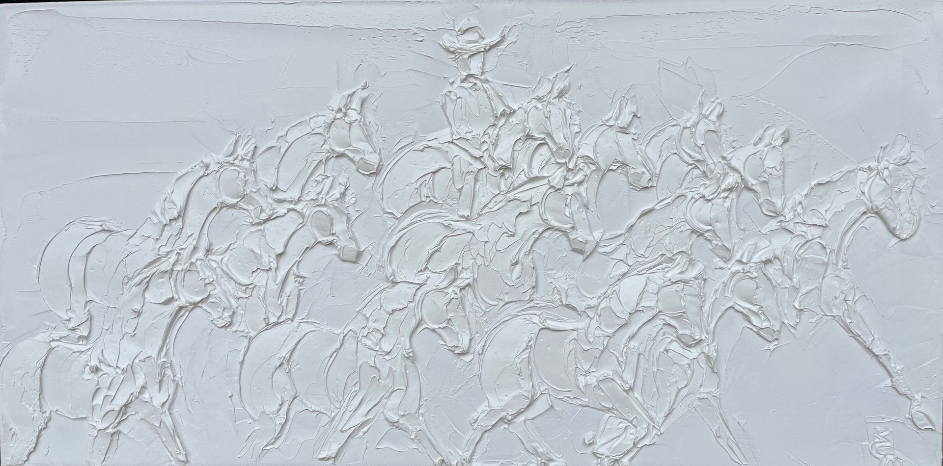 A textured white relief sculpture of a rider on a galloping horse.