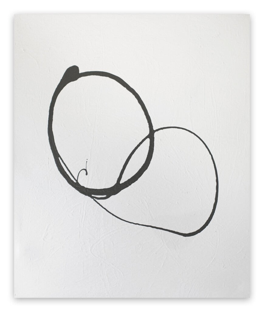 A black and white drawing of two circles on a white wall.