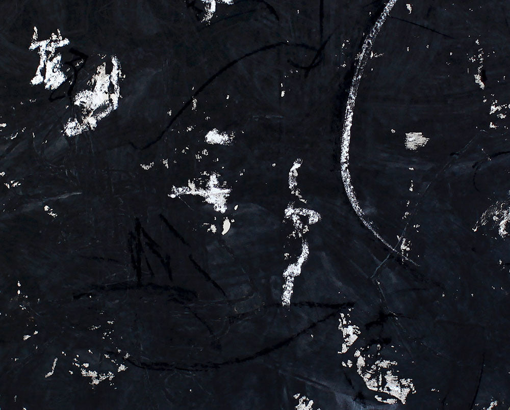 A black and white painting on a white wall.
