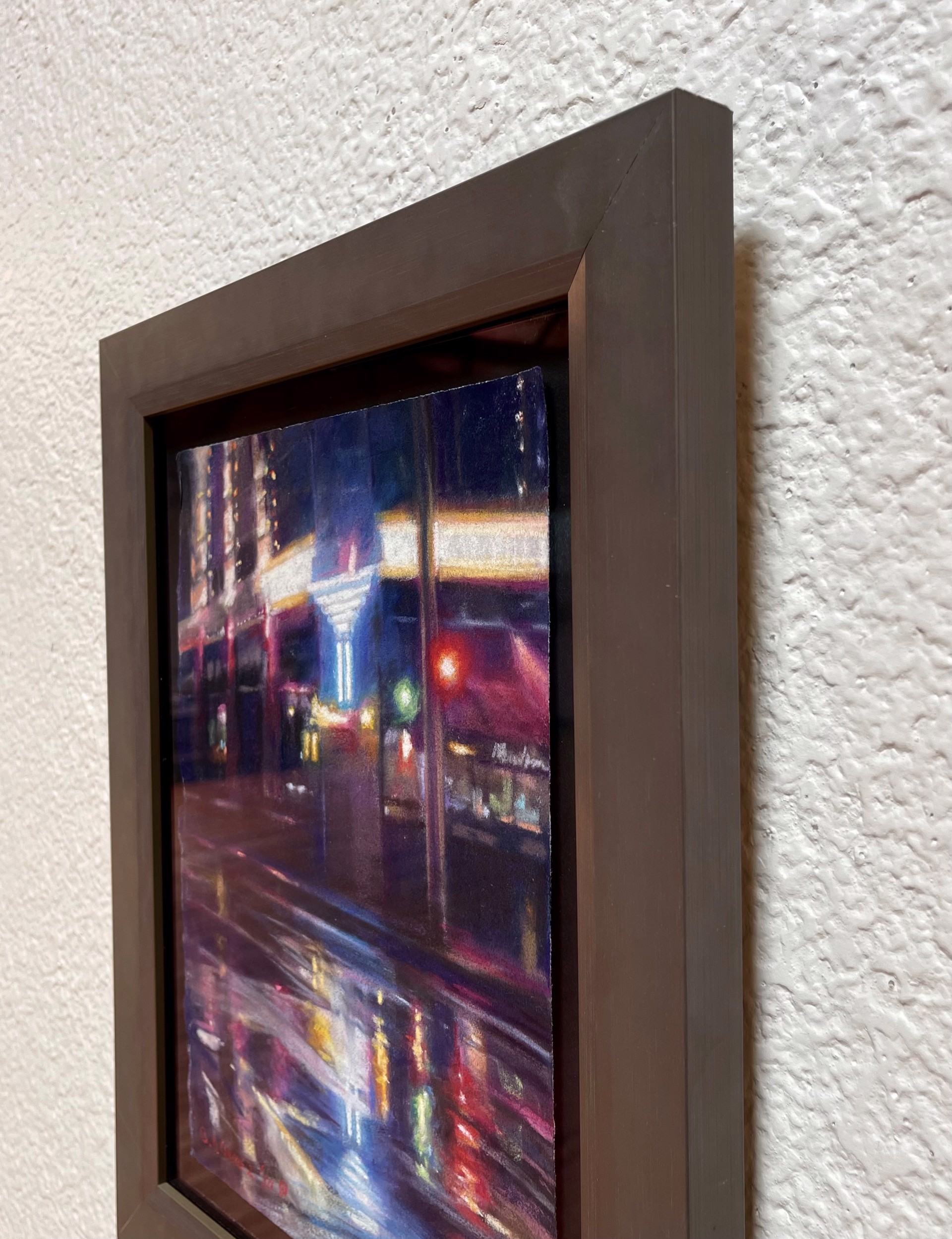 A painting of a city street at night in the rain.