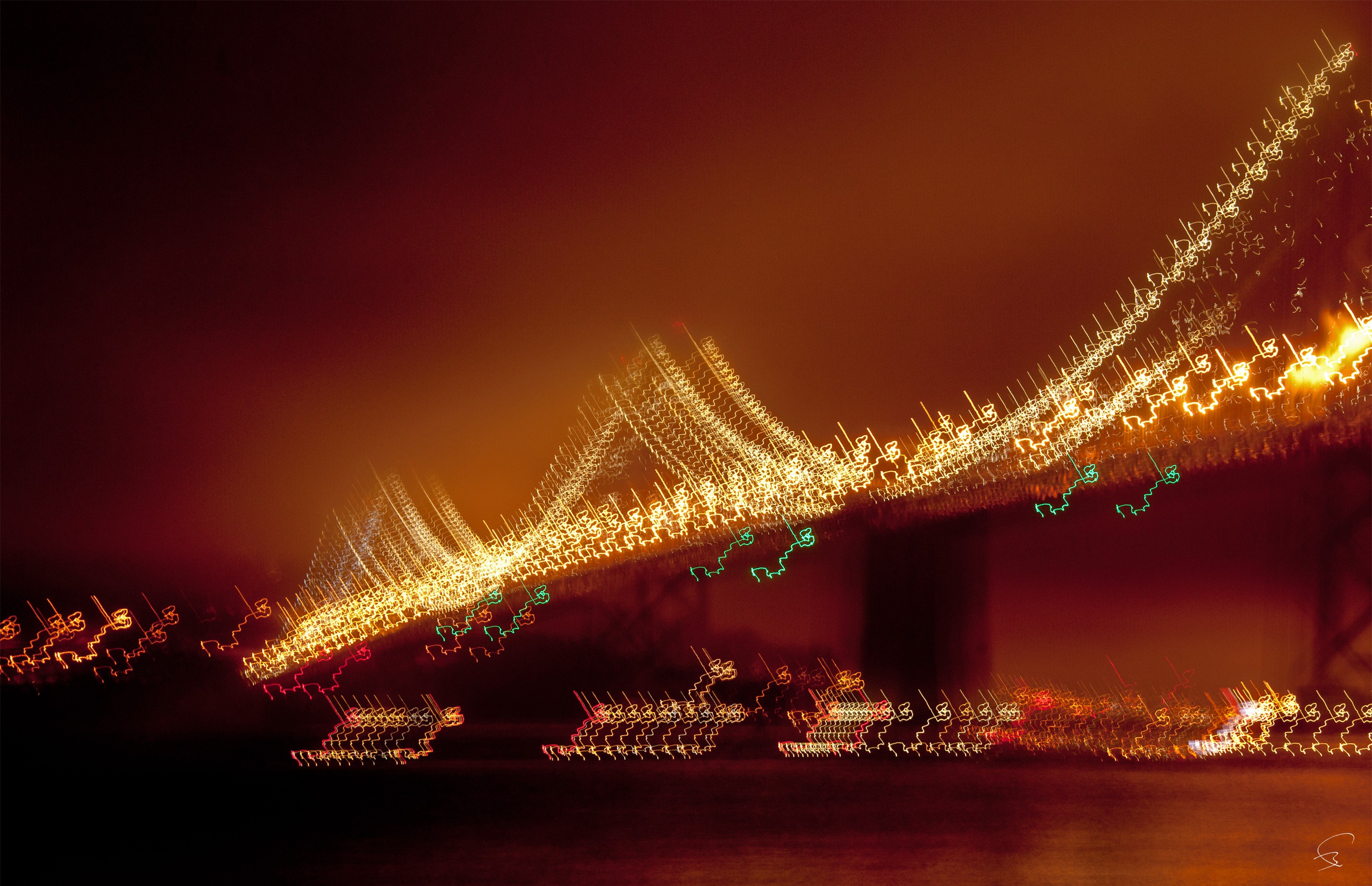 A long exposure shot of a bridge at night.