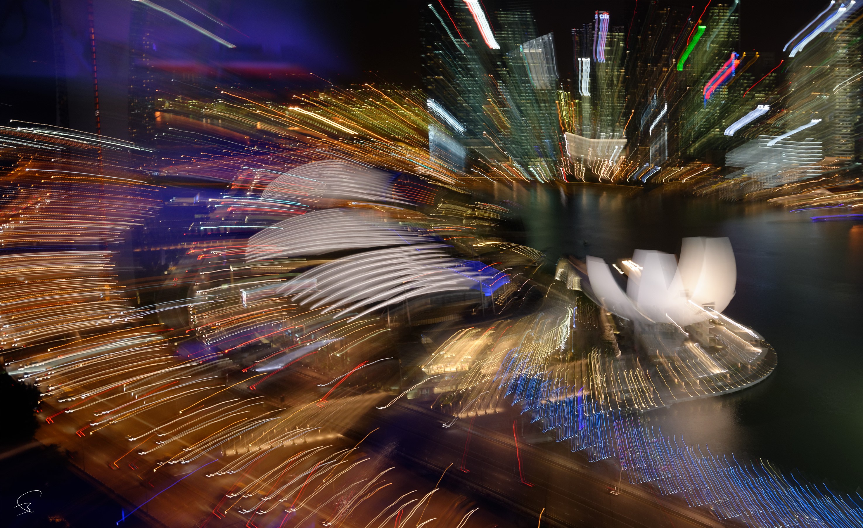 A long exposure shot of the Sydney Opera House at night.