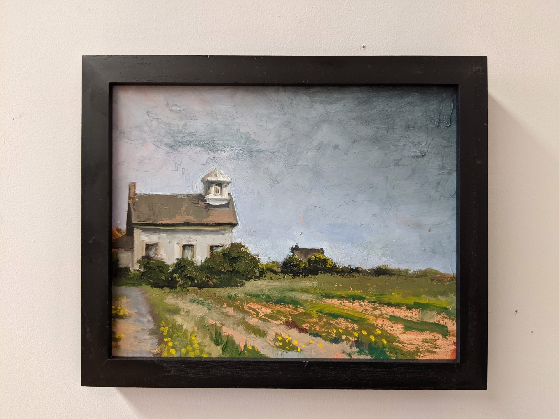 A painting of a white house in a field of flowers.