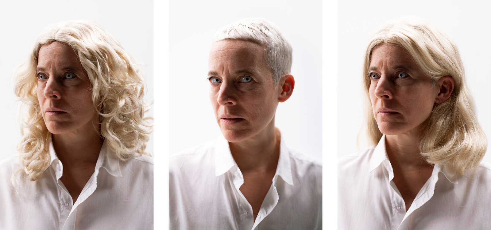 A woman with blonde hair and a white shirt.