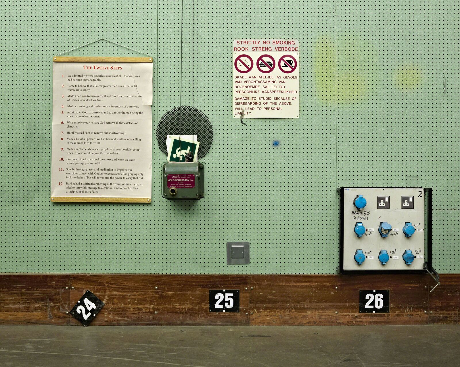 A wall with a bunch of signs on it.