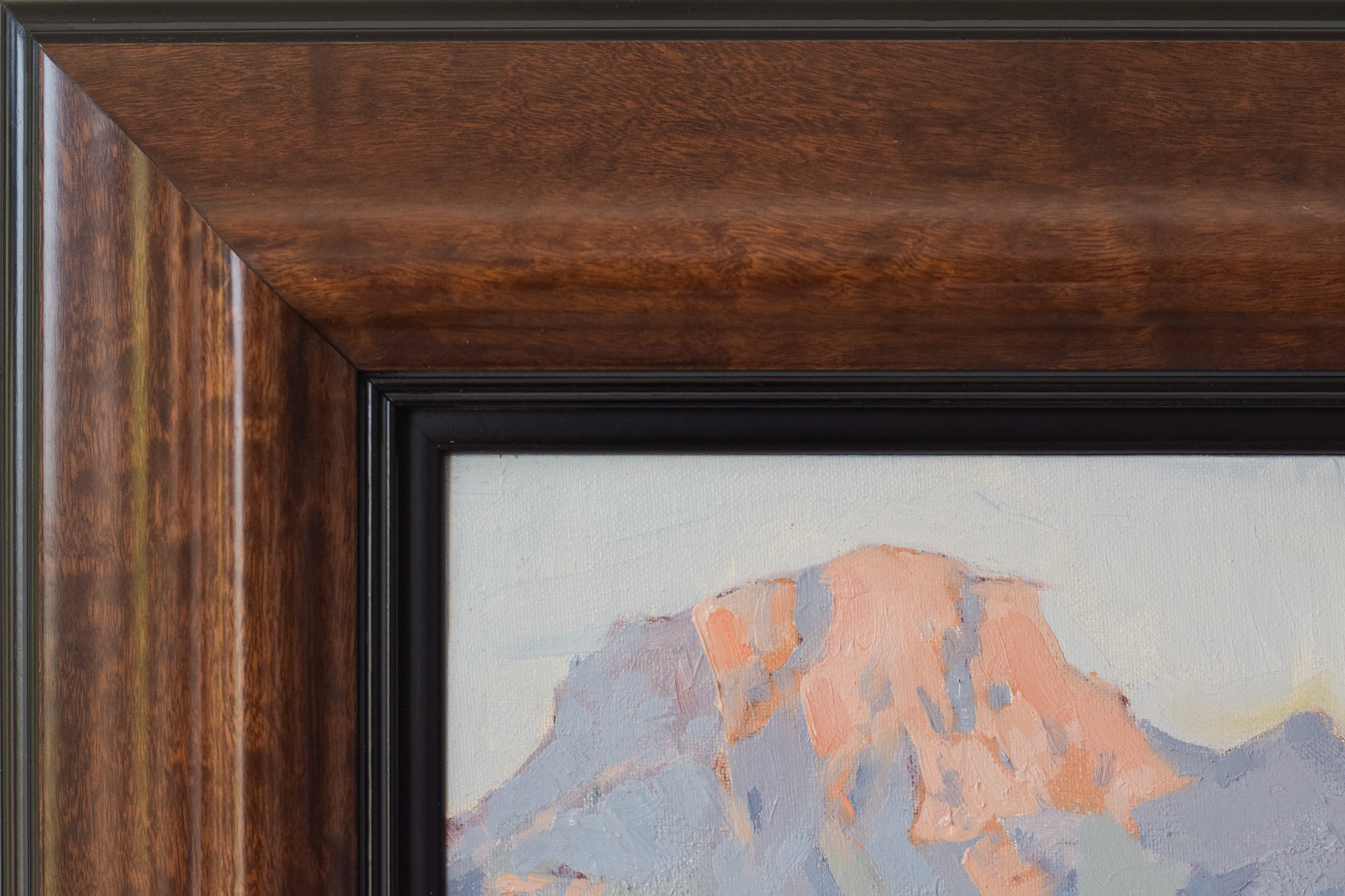A painting of a landscape with trees and mountains in the background.