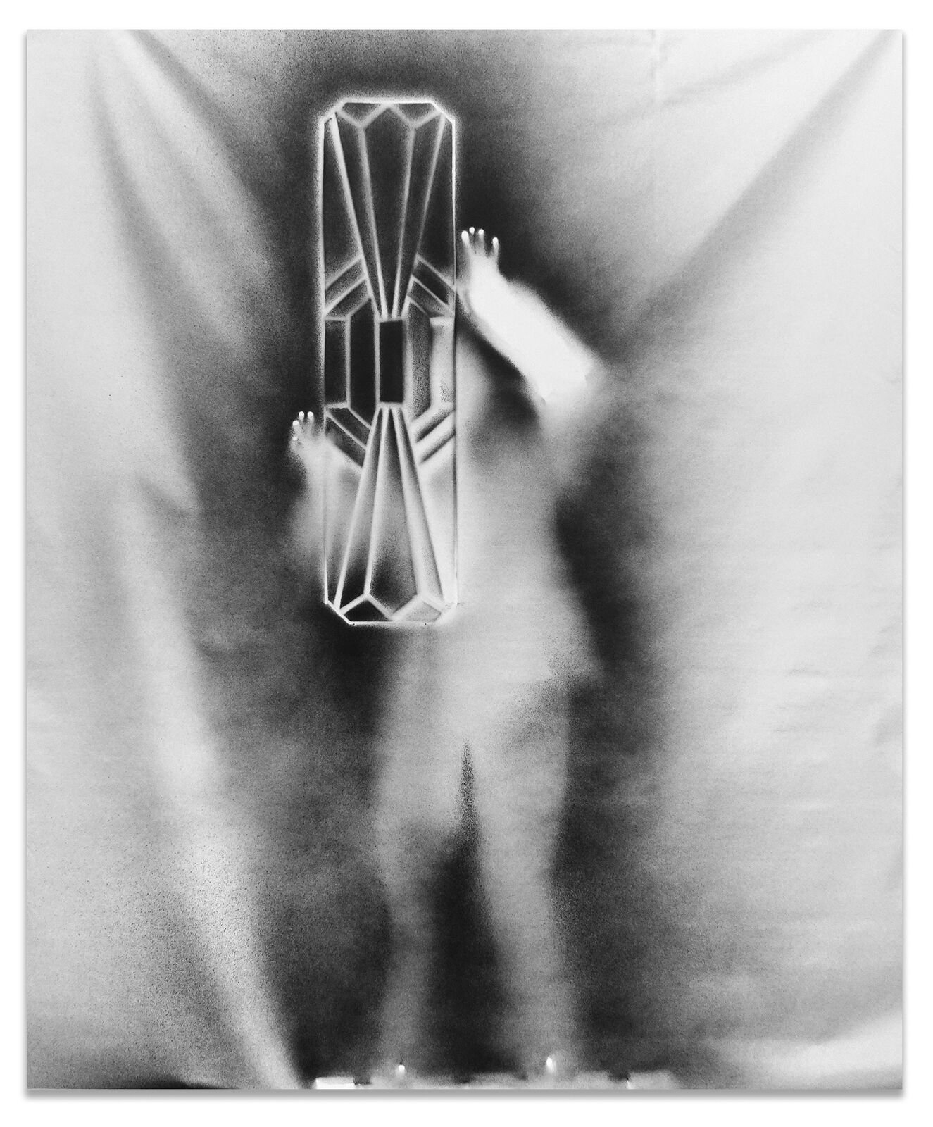 A black and white photo of a person standing in front of a mirror.