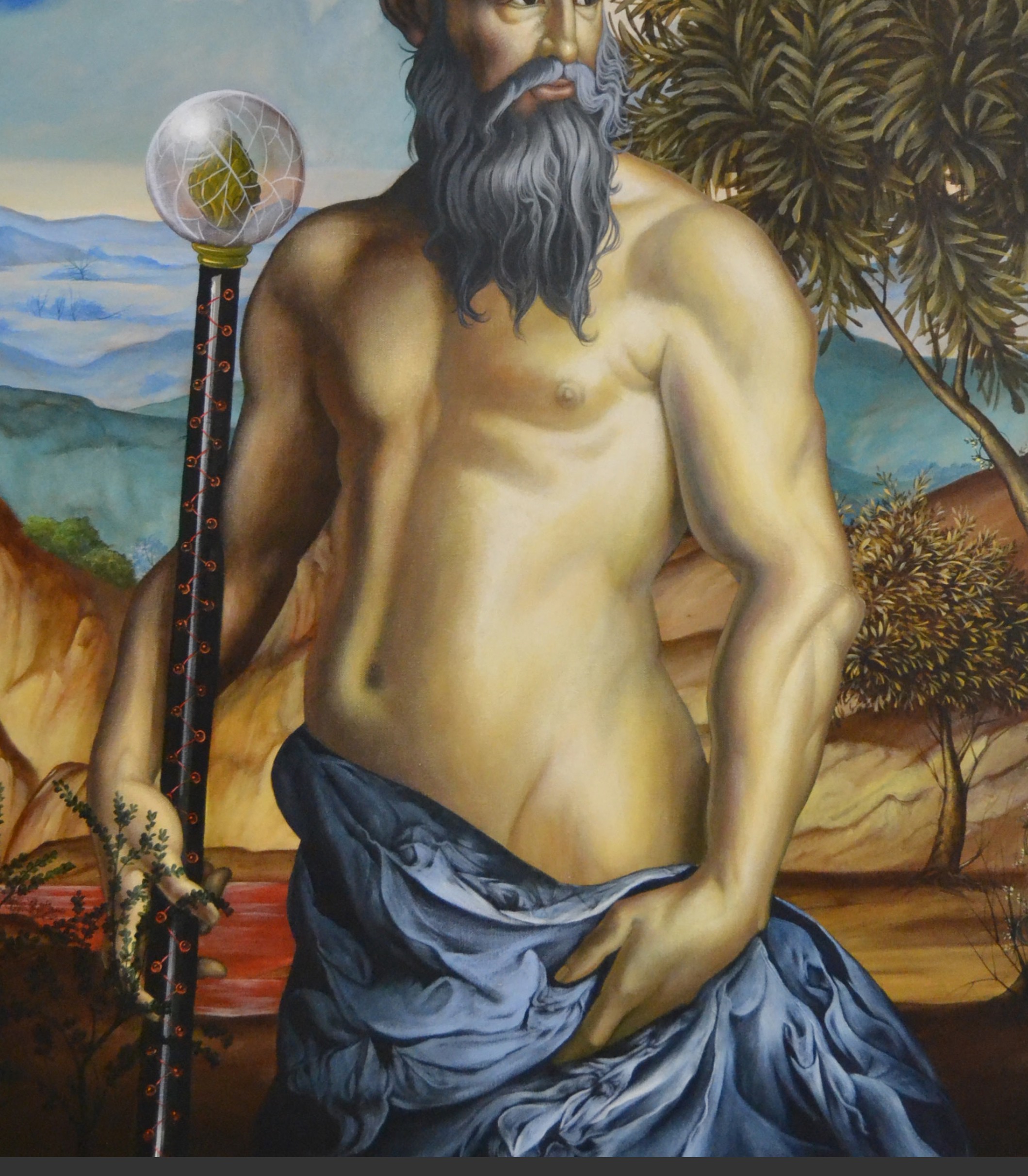 A painting of a man with a long beard holding a staff.