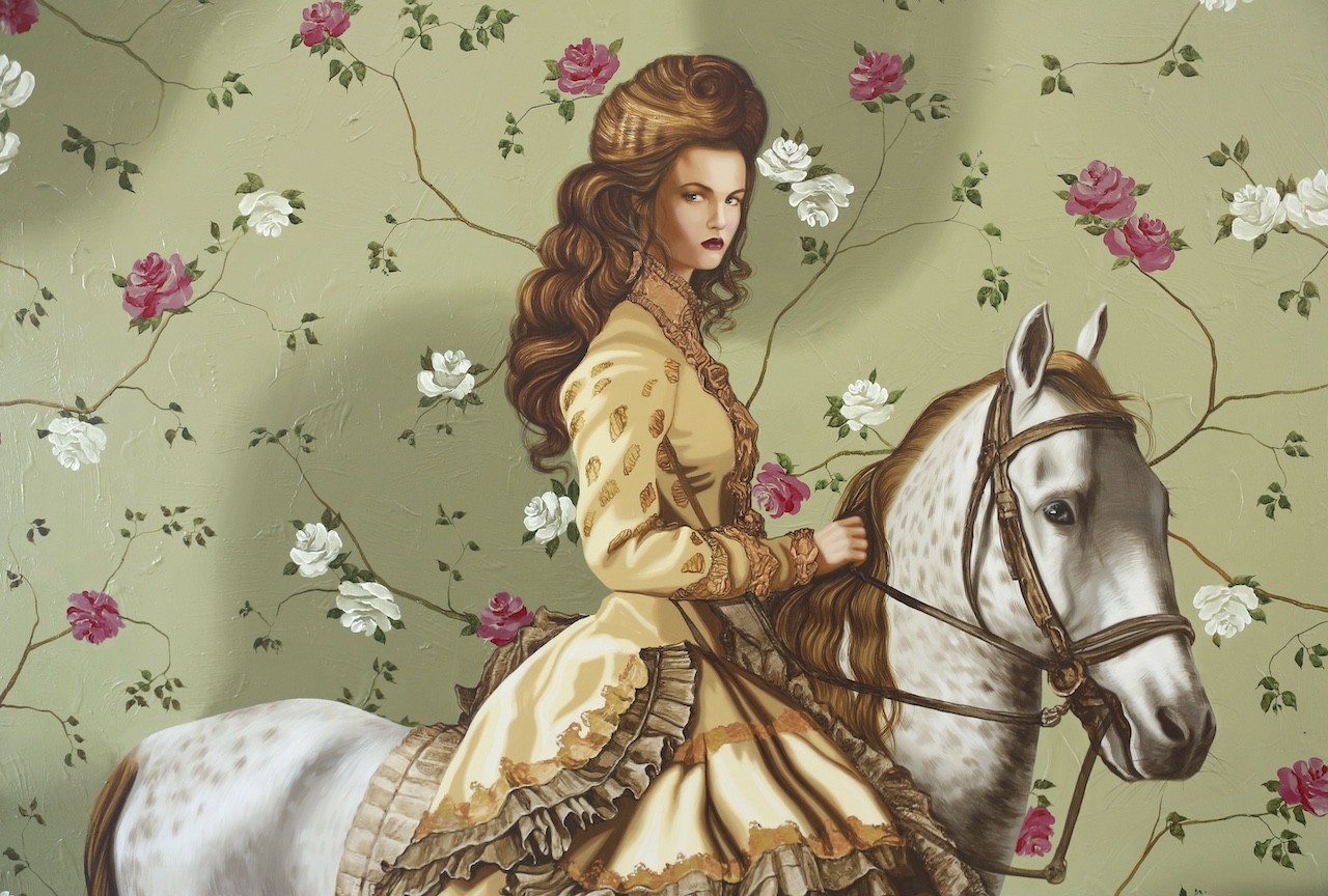 A woman riding a white horse in front of a floral wallpaper.