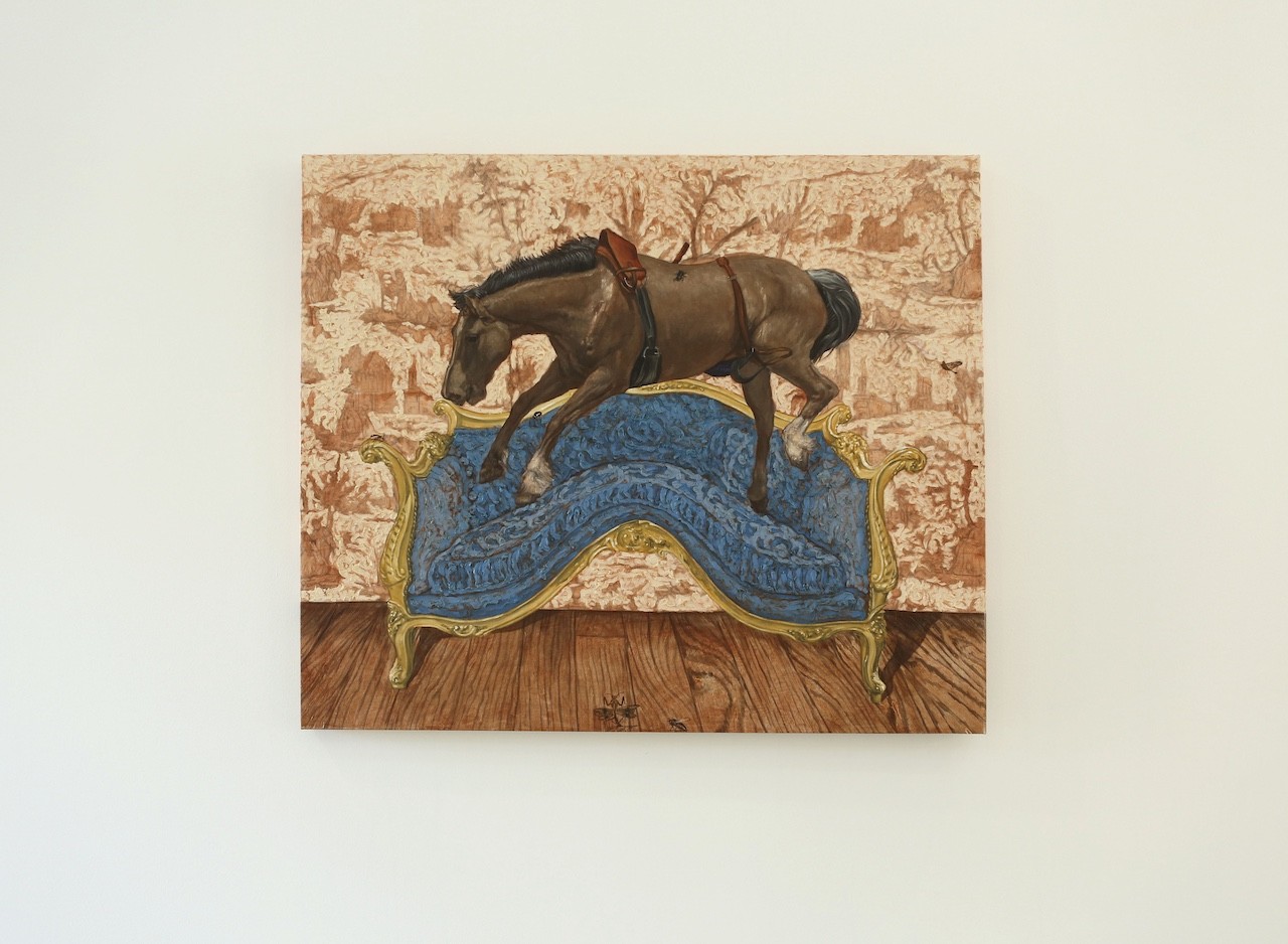 A painting of a horse on a couch in a room.
