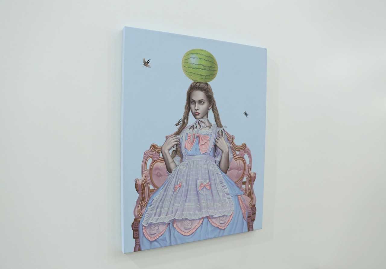 A painting of a girl sitting on a chair with a watermelon on her head.
