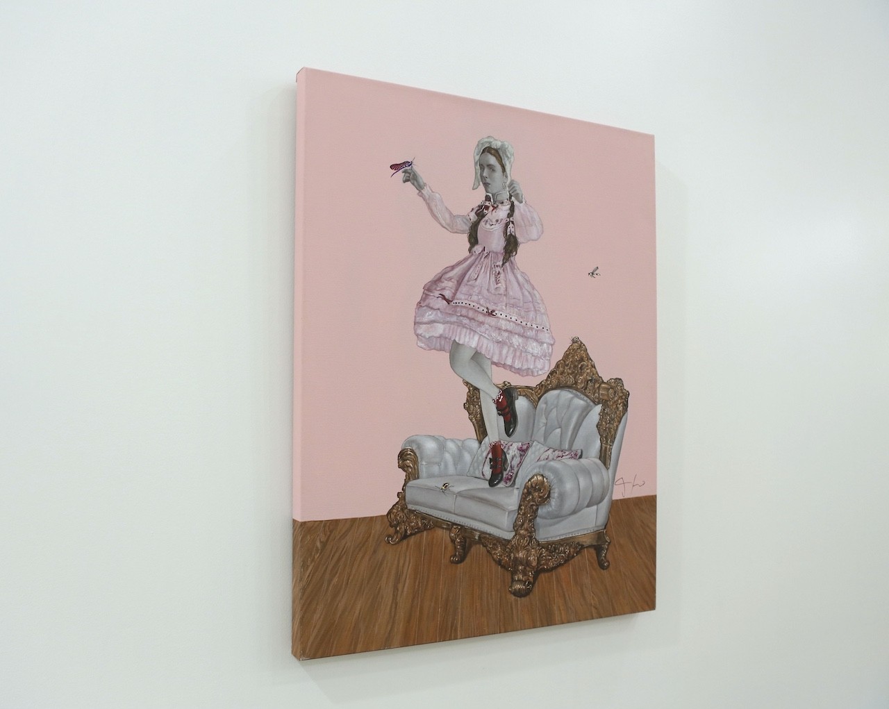 A painting of a woman in a pink dress sitting on a chair.