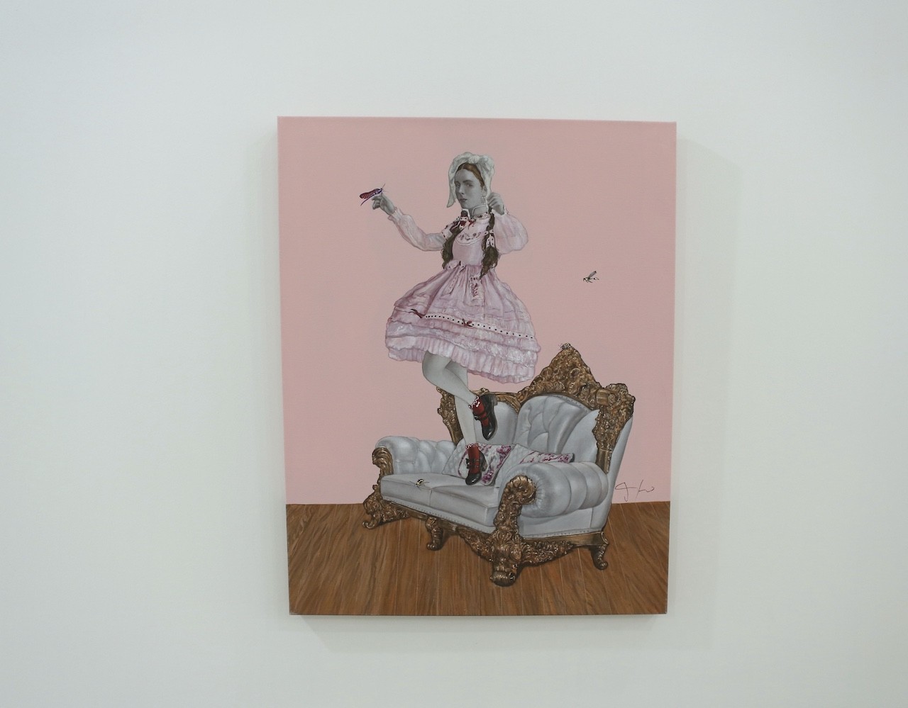 A painting of a woman in a pink dress sitting on a chair.