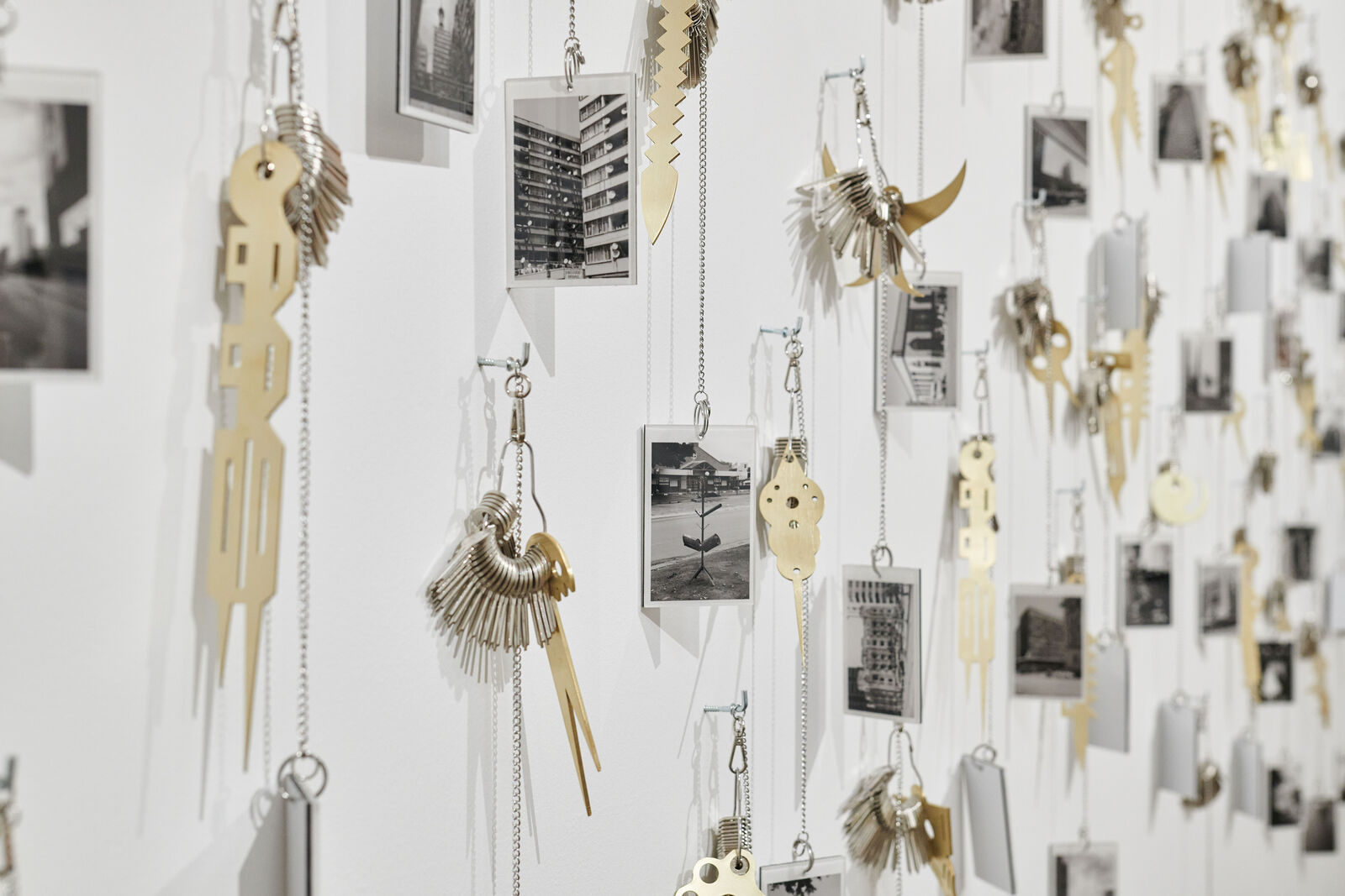 Artwork by Carlos Garaicoa, Goqa, Made of Photographs, keys, rings, brass instruments, rings 