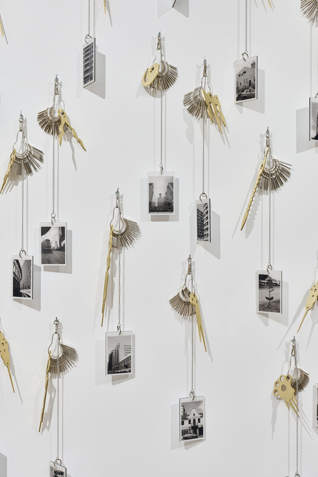Artwork by Carlos Garaicoa, Goqa, Made of Photographs, keys, rings, brass instruments, rings 
