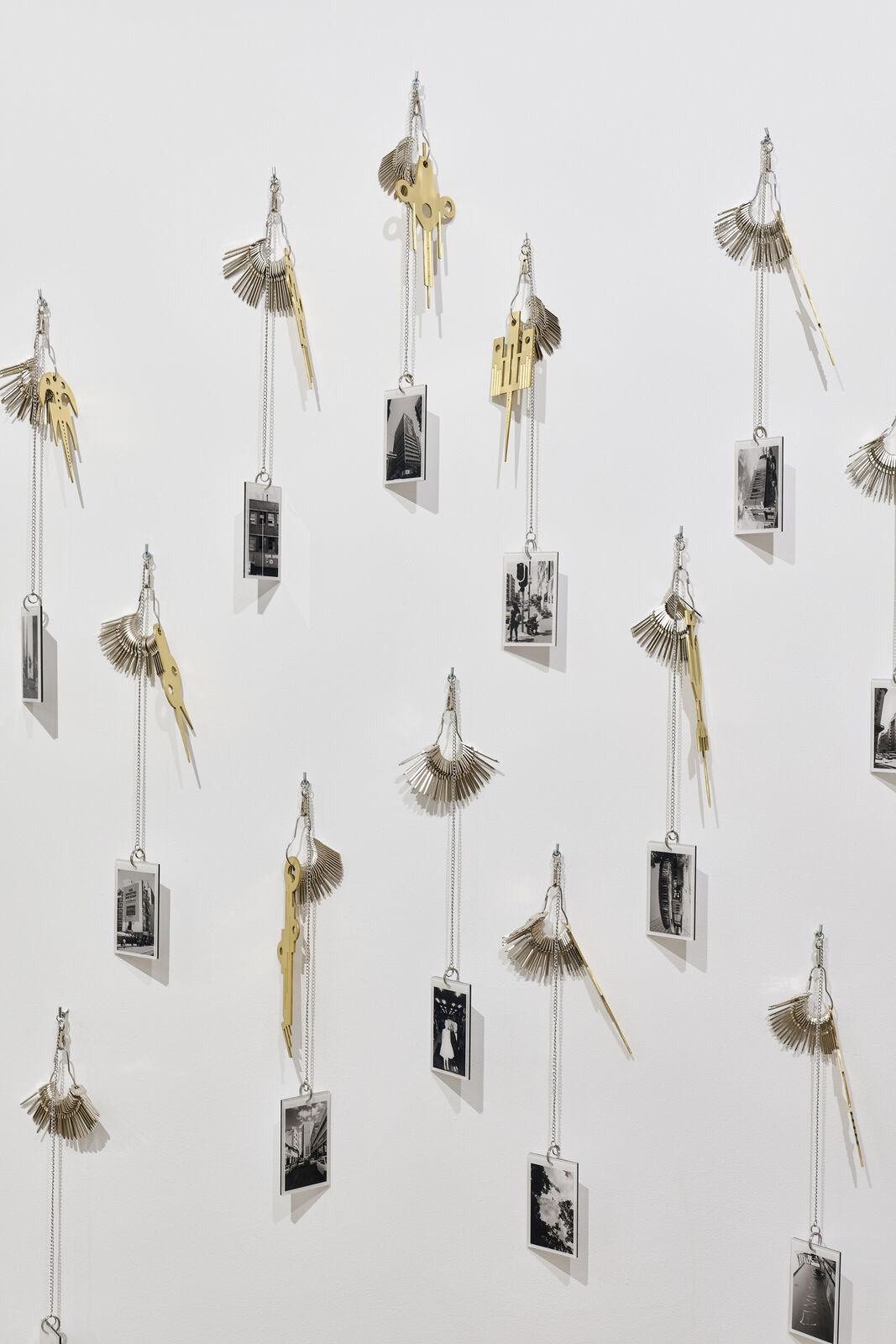 Artwork by Carlos Garaicoa, Goqa, Made of Photographs, keys, rings, brass instruments, rings 