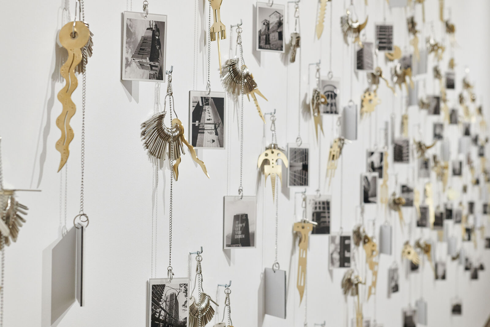 Artwork by Carlos Garaicoa, Goqa, Made of Photographs, keys, rings, brass instruments, rings 