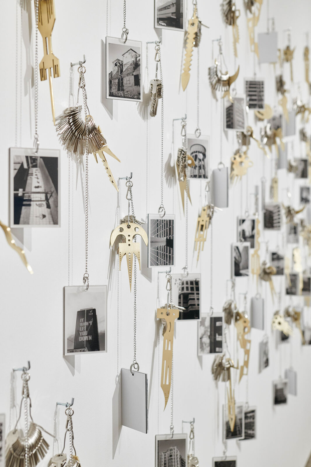 Artwork by Carlos Garaicoa, Goqa, Made of Photographs, keys, rings, brass instruments, rings 