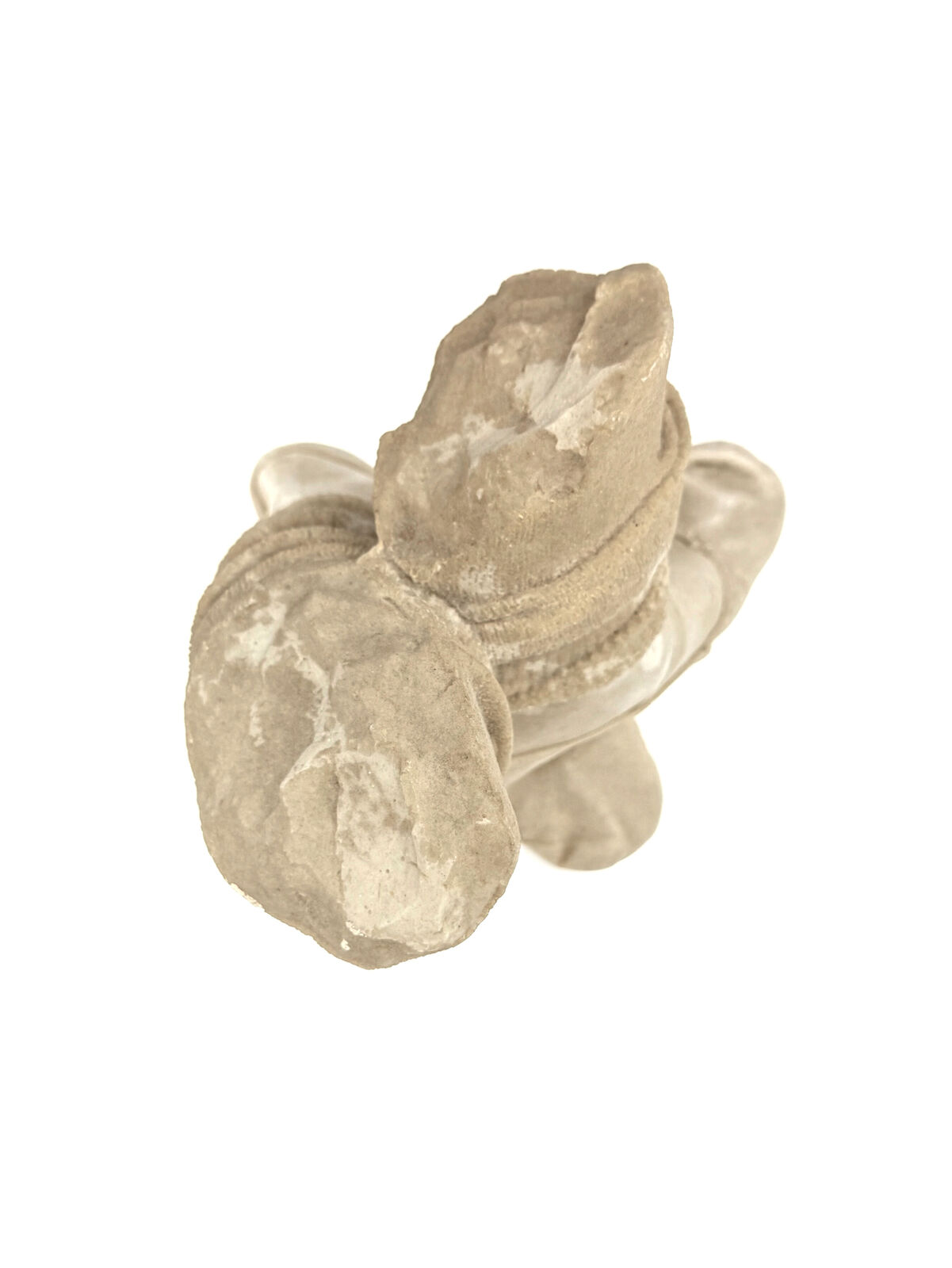 A pair of beige shoes with a hat on top of them.