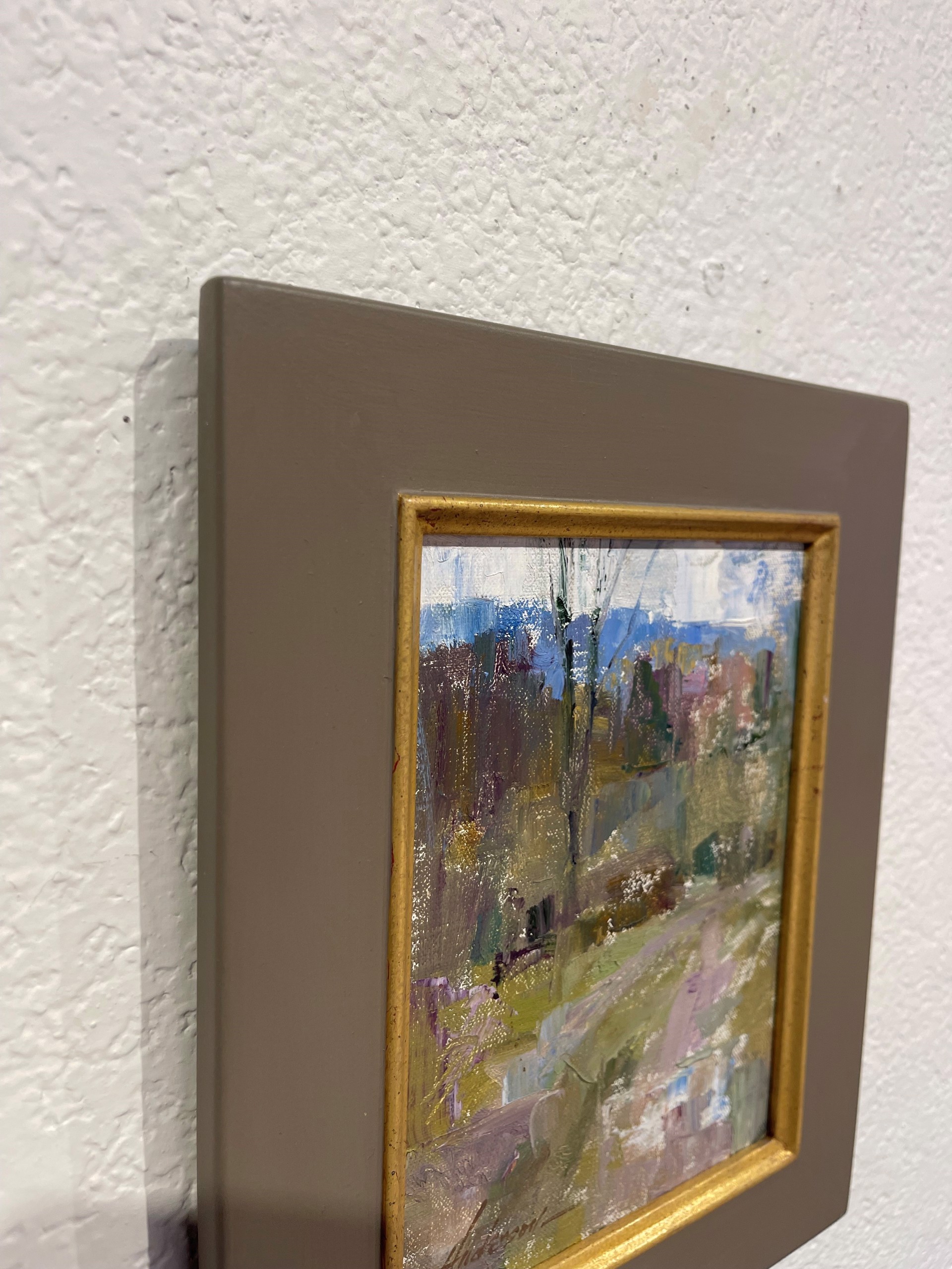 An atmospheric landscape painting of a rural path winding through a wooded area.