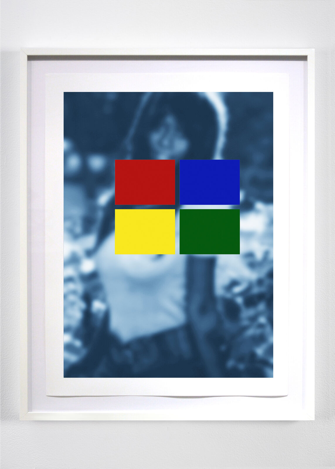 A picture of a person holding a camera in front of a white frame.