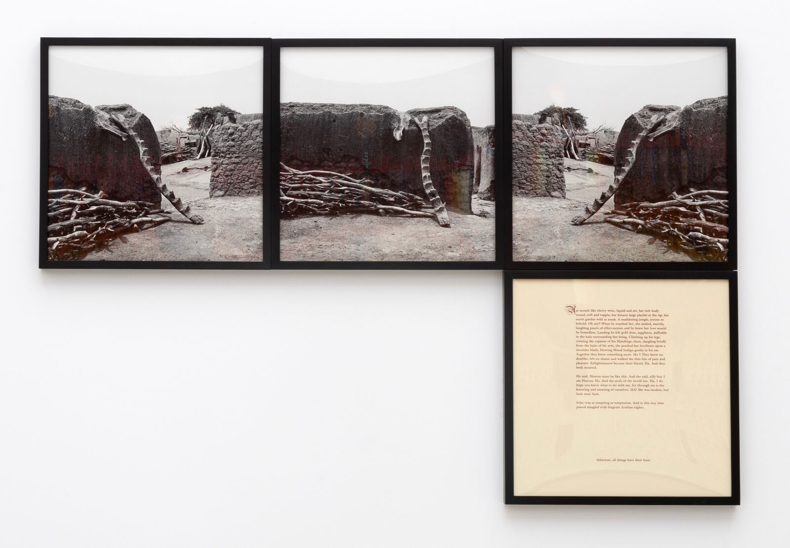 A black and white photo of three framed pictures hanging on a wall.